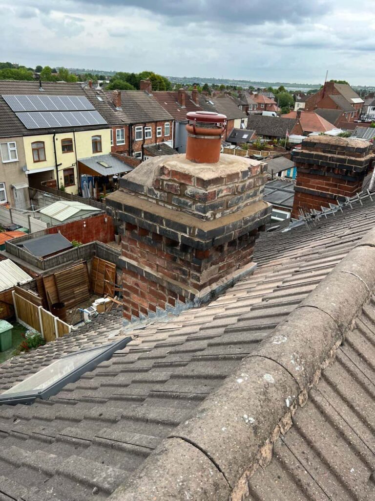 This is a photo taken from a roof which is being repaired by Burntwood Roofing Repairs, it shows a street of houses, and their roofs